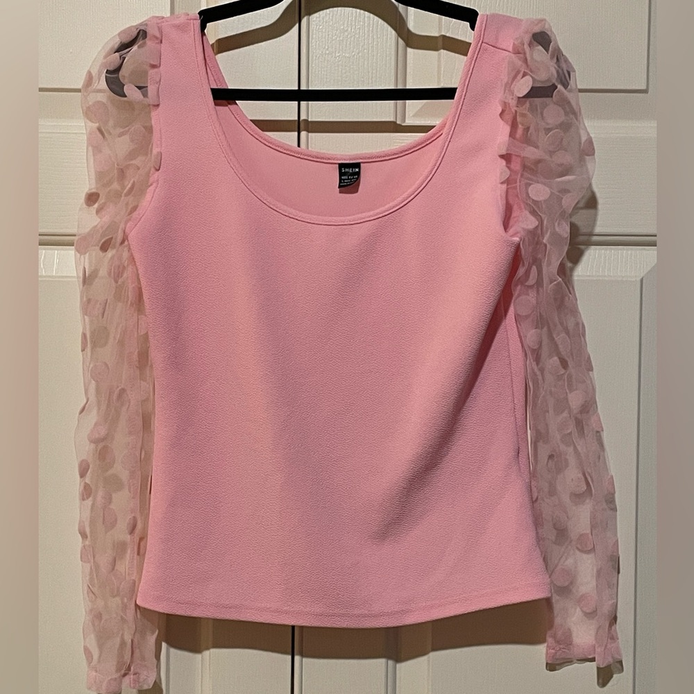 Pink top with sheer polkadot sleeves
